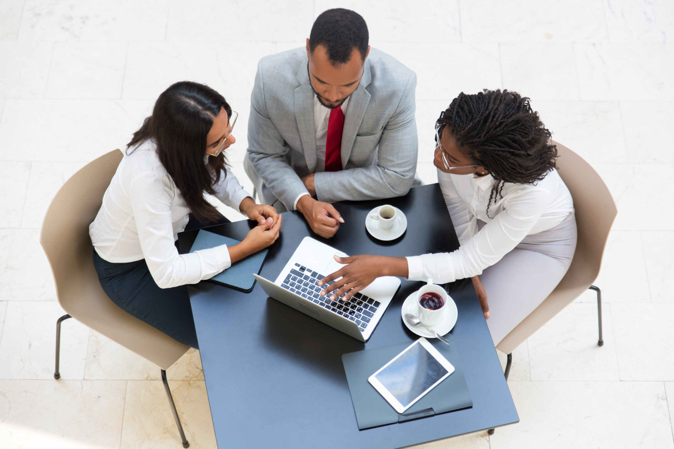 https://midaslg.com/wp-content/uploads/2025/07/business-team-working-laptop-1-scaled.jpg